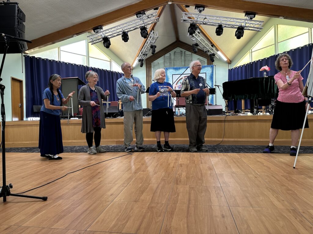 People playing bells at the Gathering, Hey Days 2025.