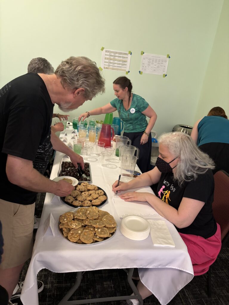Selling treats at the live auction at Hey Days 2025.